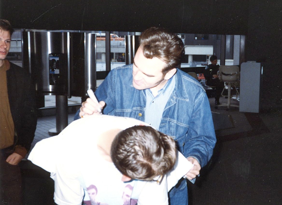 Morrissey signing a pillow